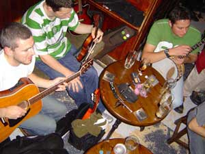 musicians gathered around the table at a traditional Irish session in Sean's Bar, Athlone