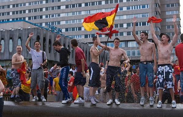Young fans celebrating in the fountain of Madrid